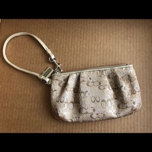 Coach wristlet with gold and silver c’s